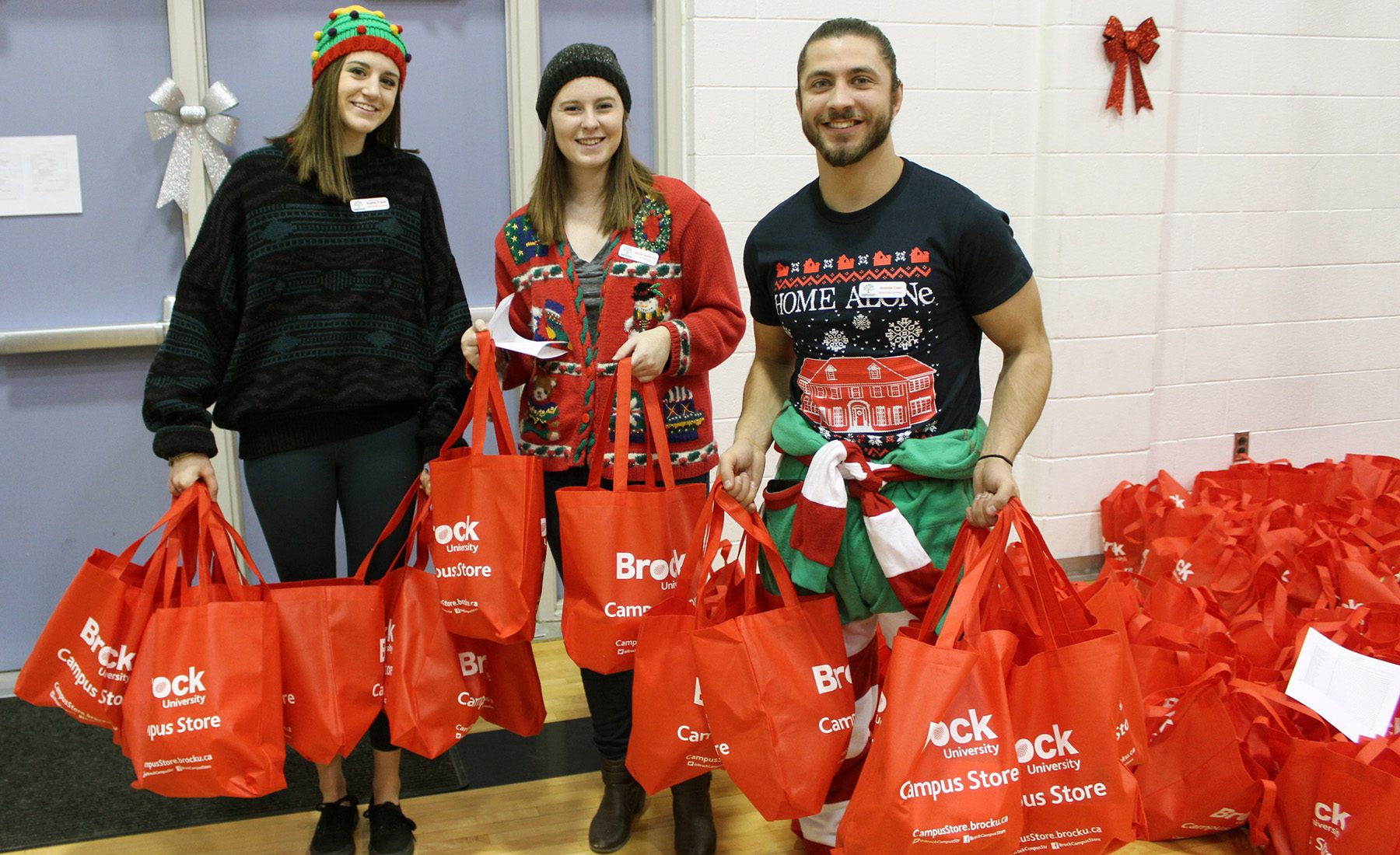 Brock volunteers get gift bags ready for Prince of Wales Public School students at the Holiday Extravaganza.
