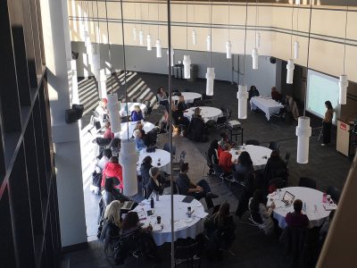 Attendees around tables at the 