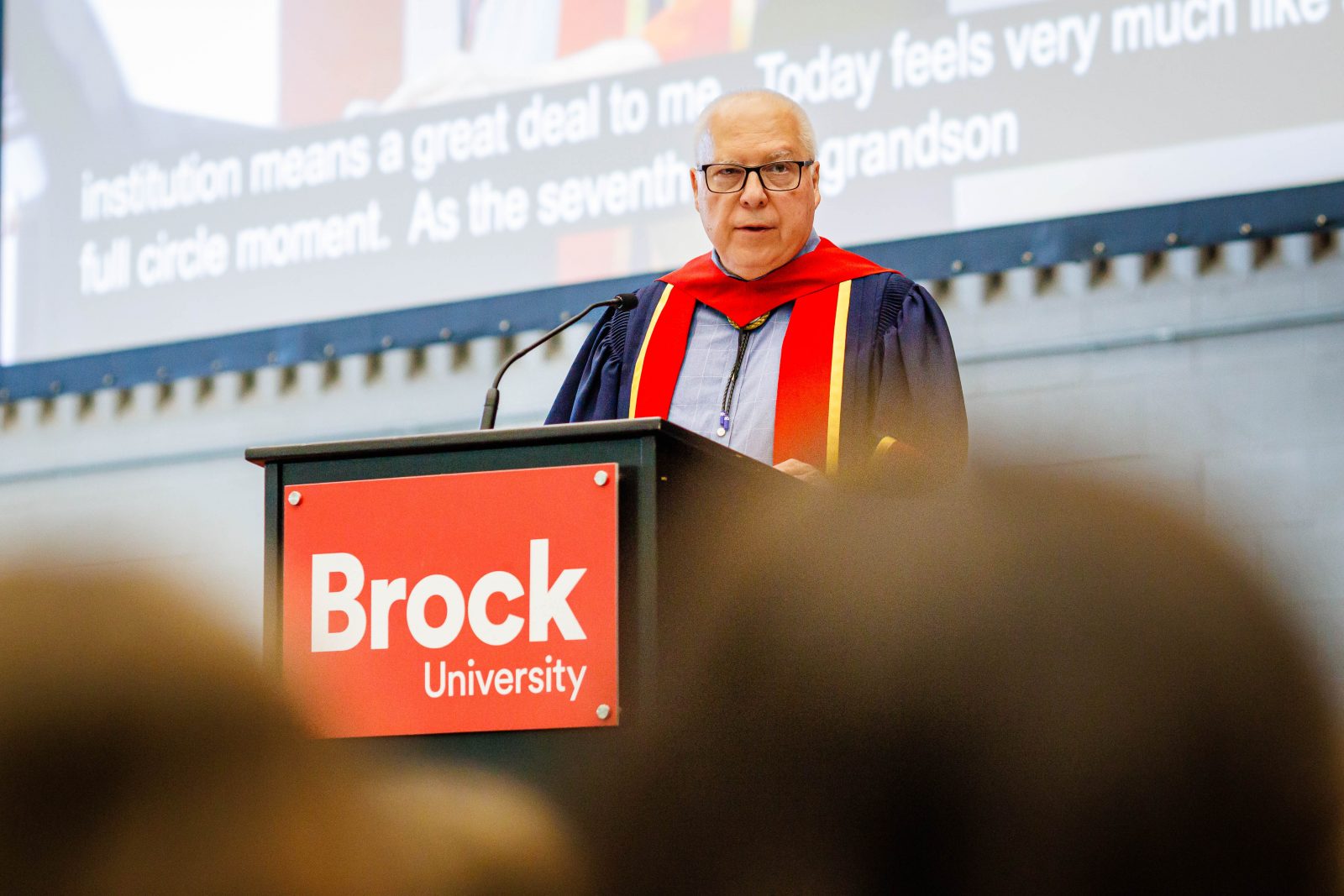 A man stands at a podium giving a speech.
