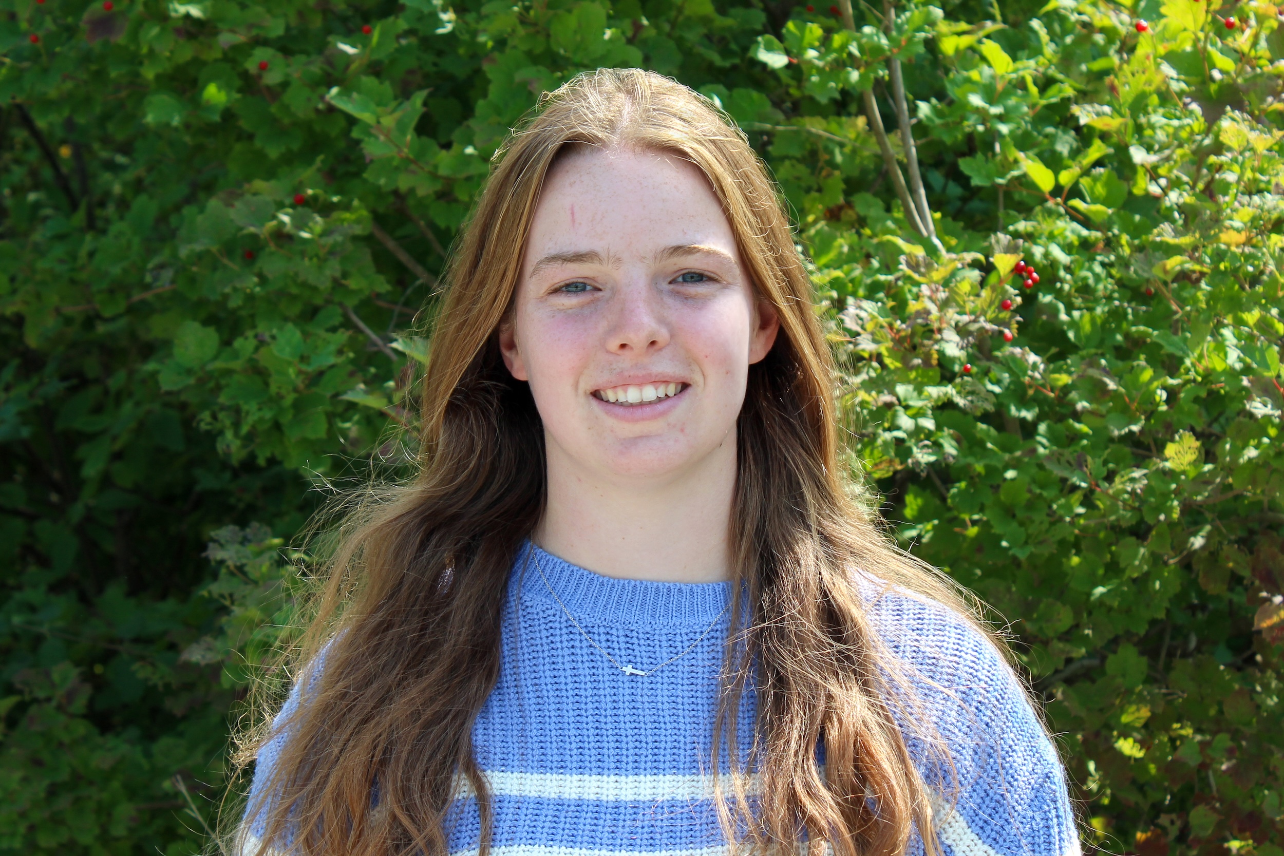 Ruth Horn 2 Final Ruth Horn standing in front of trees.