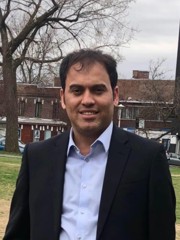 Naser Ezzati-Jivan standing outside