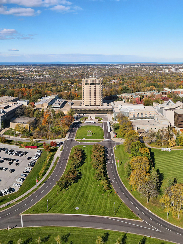 Students walking by the Cairns Complex on Brock's main campus