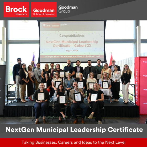 A group of people are standing and sitting on a stage holding certificates. A screen behind them reads "Congratulations. NextGen Municipal Leadership Certificate - Cohort 23”.