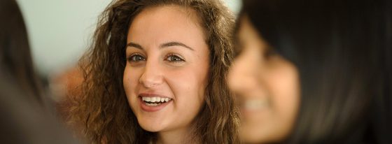 A Goodman student is smiling