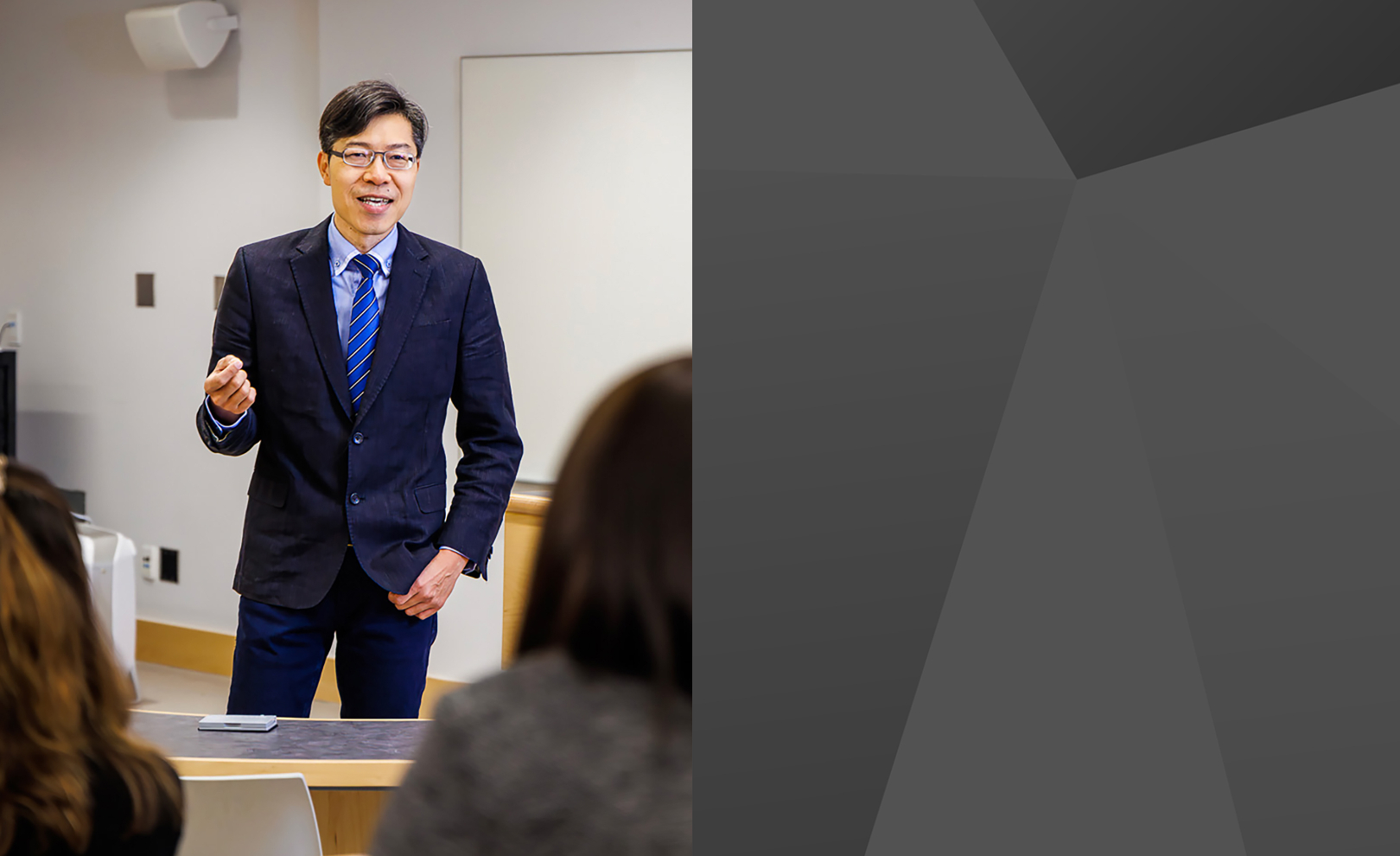 Photo of professor Kai-Yu Wang in a Goodman school of Business Classroom 