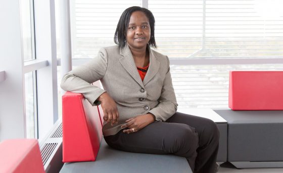 Kareen Brown seated on a bench.