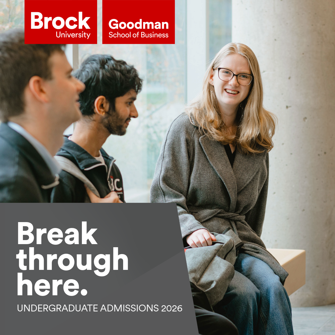 Viewbook Cover. Text "Break through in Business." Photo of students standing outside