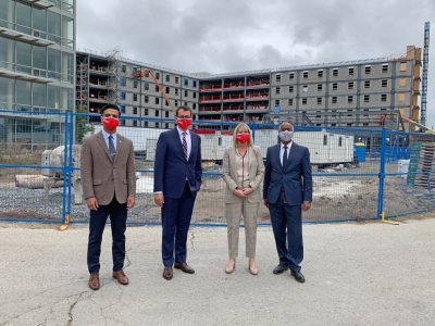 people wearing a Brock University red face mask