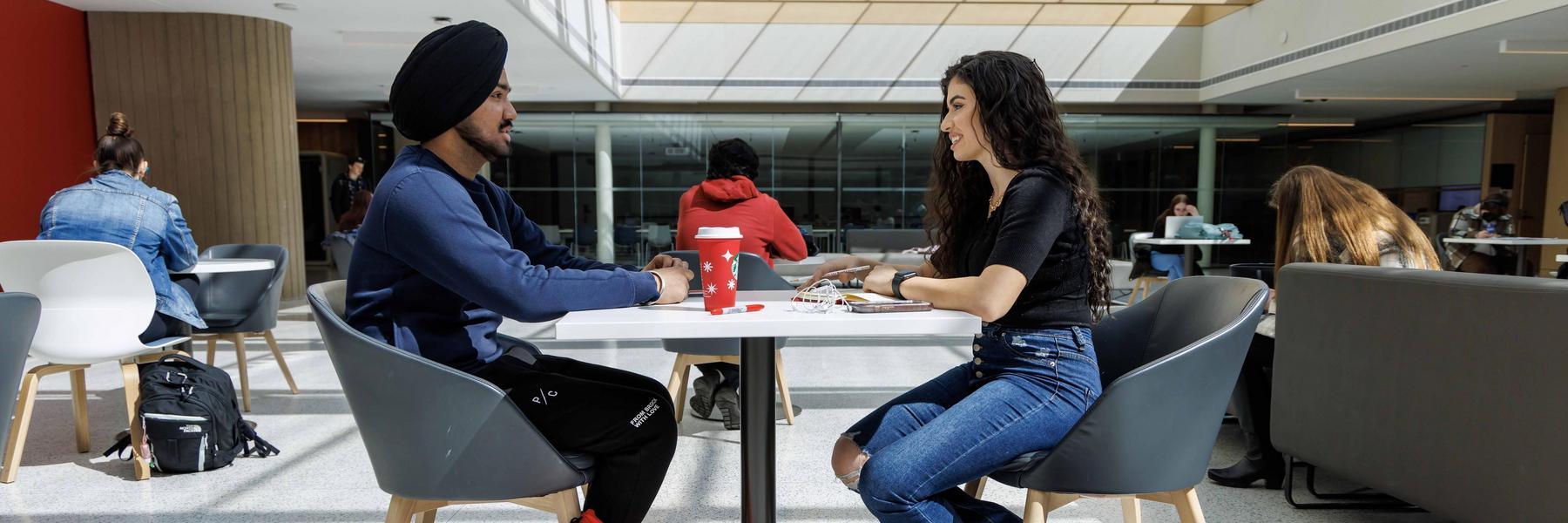 2 students talking in the Rankin pavilion at Brock University