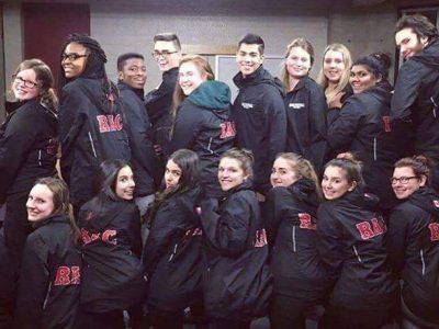Group photo of RAC members wearing black RAC jackets