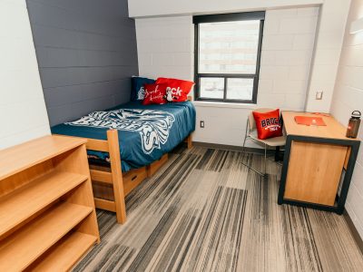 Residence 8 bedroom with Brock decorative comforter and pillows.