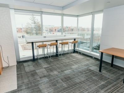 Residence 8 lounge area with countertop, charging outlets and chairs