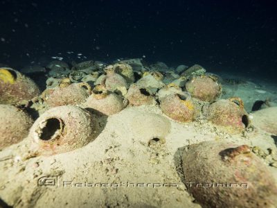 underwater view of ancient clay vessels