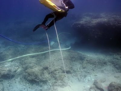 scuba diver carrying an underwater balloon