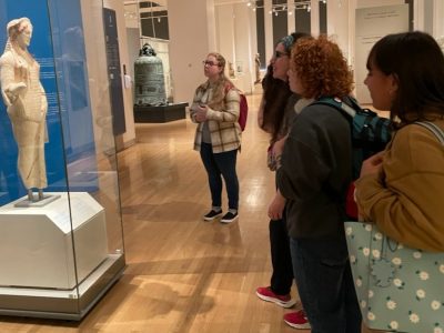 Andrea, Elizabeth, Emily, Katie, and other students get up close and personal with Kore 670 at the ROM.