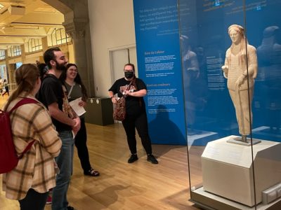 Andrea, Dawson, Julia, and others discuss the artistic details visible on Kore 670