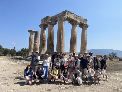 Study Tour of Greece students in front of ancient columns
