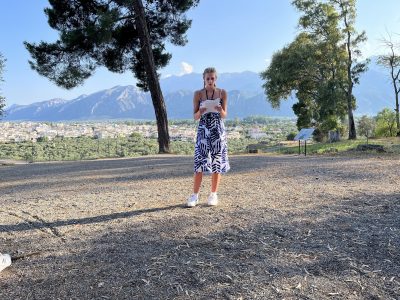 student with paper on a Study Tour of Greece