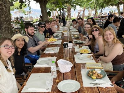 group of students on a Study Tour of Greece at table waiting for food