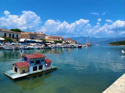 Study Tour of Greece view of a small house boat in a lake