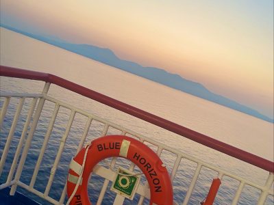 life preserver on a boat that reads Blue Horizon