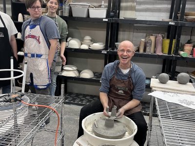 Prof. Michael Carter shows off his pottery throwing skills