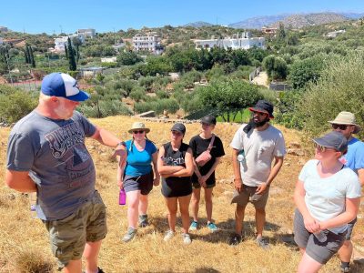 Dr. Matt Buell shows students around the site of Khavania