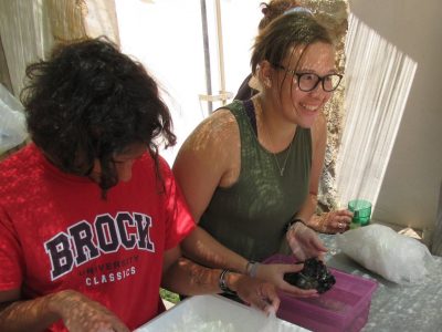 2 brock students looking at rocks