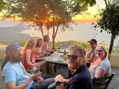 7 students having a snack at sunset in Koukounari