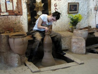 Aleks tries making pottery in the workshop Chez Galip