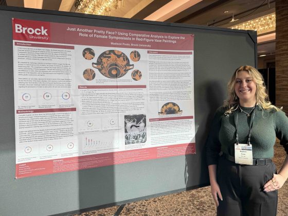 Madison Poole presenting her poster at the AIA Annual Meeting
