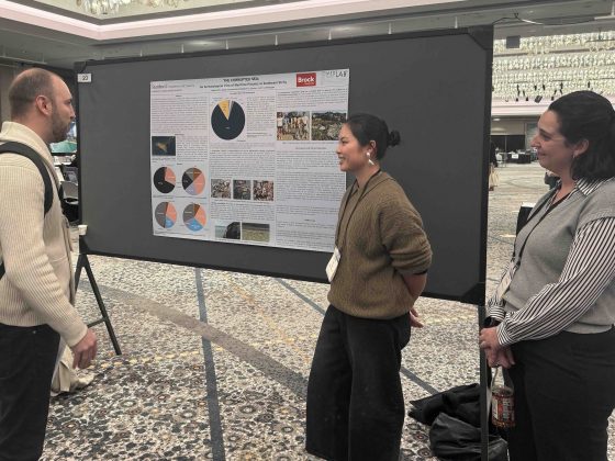 Students presenting poster at the AIA Annual Meeting