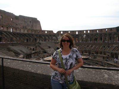 Dani poses before the Colosseum