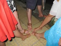 5 womwn's feet showing off Sandal shopping. Plaka, Athens