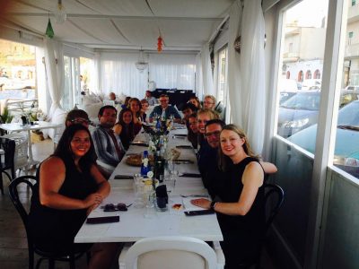 group of people sitting at Dinner in Pantelleria