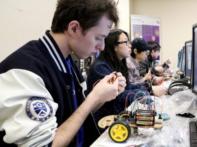 student working on a robotics
