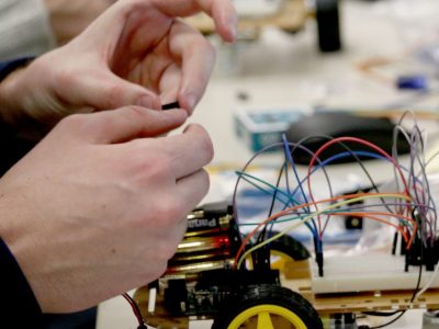 student working on a robot