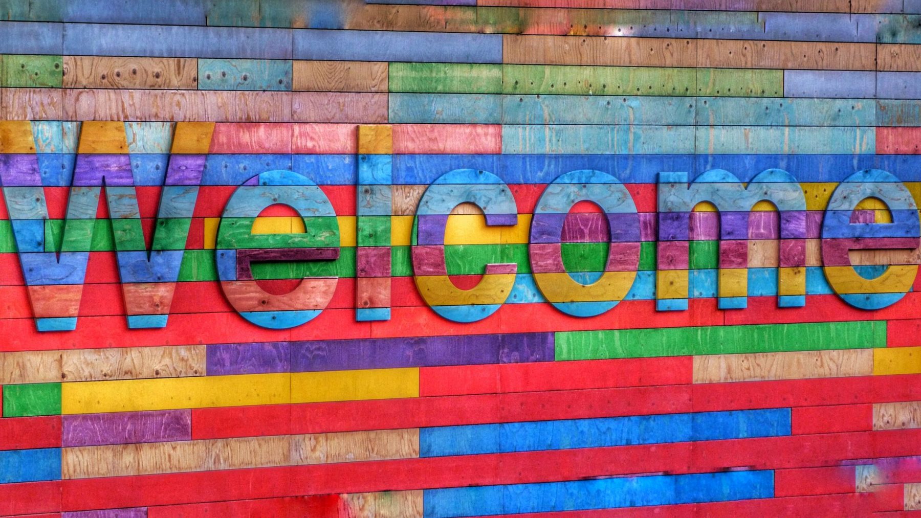 Welcome sign made from colourful wood