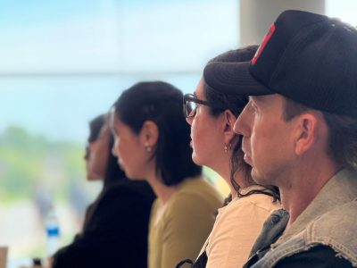 side view of HUMA students listening