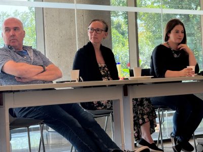 faculty at table during Welcome week