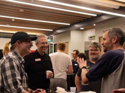 Aaron Mauro talking with others at Digital Humanities Industry Night