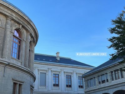 A photo of a courtyard on a sunny day at Lyon 2 University in France.