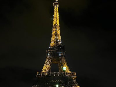 The Eiffel Tower illuminated at night.