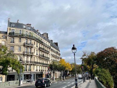 A photo of a building in Paris, France with a street in front of it.