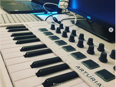 a white mini MIDI keyboard