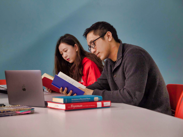 People study on the fifth floor of the Library