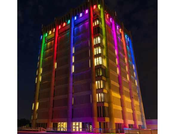 The Schmon Tower illuminated in rainbow colours