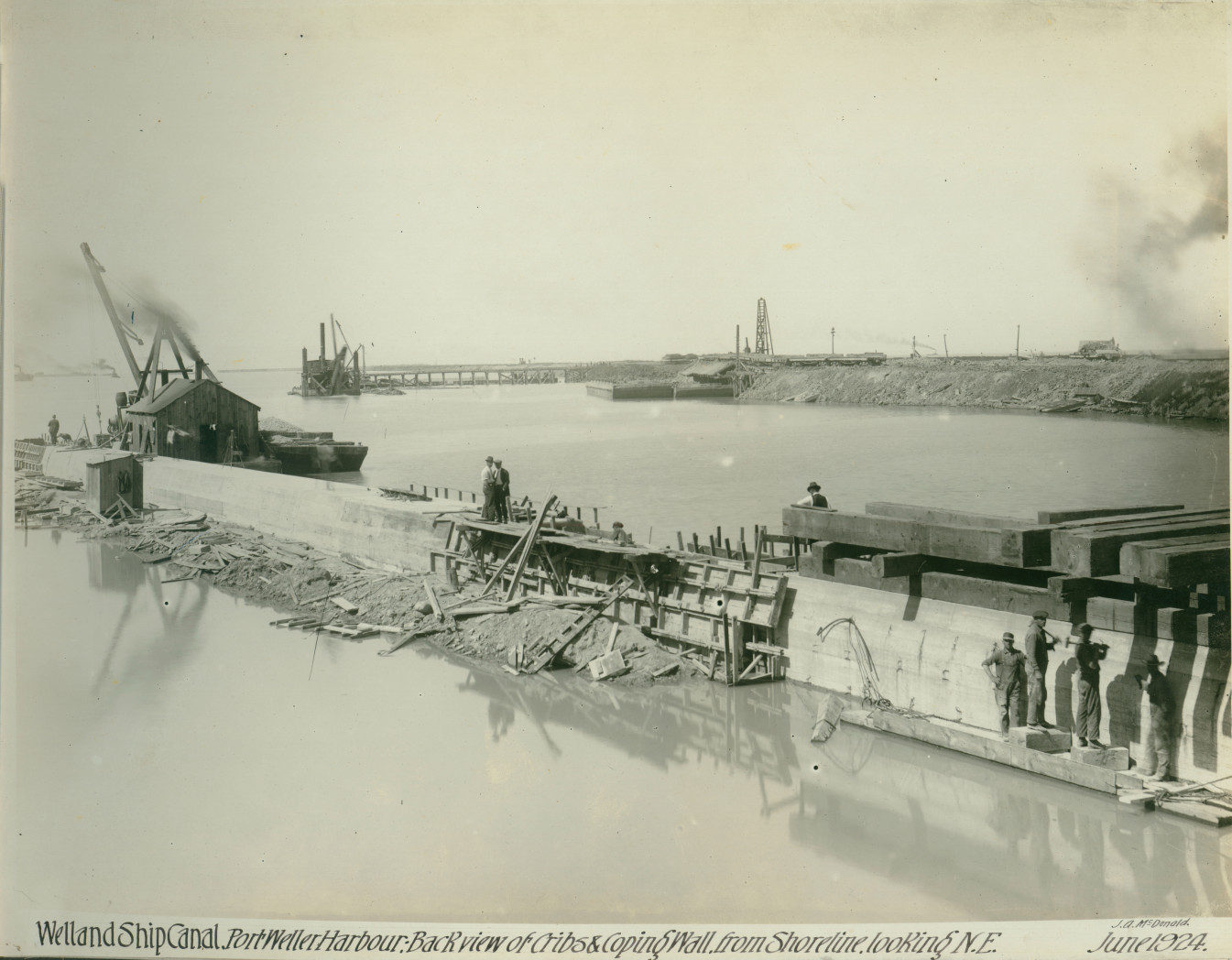Page from a photo scrapbook of the building of the Welland Canal