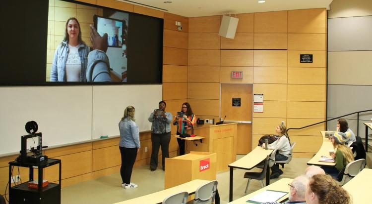 makerspace staff in Thistle Auditorium Classroom demonstrating technology to students