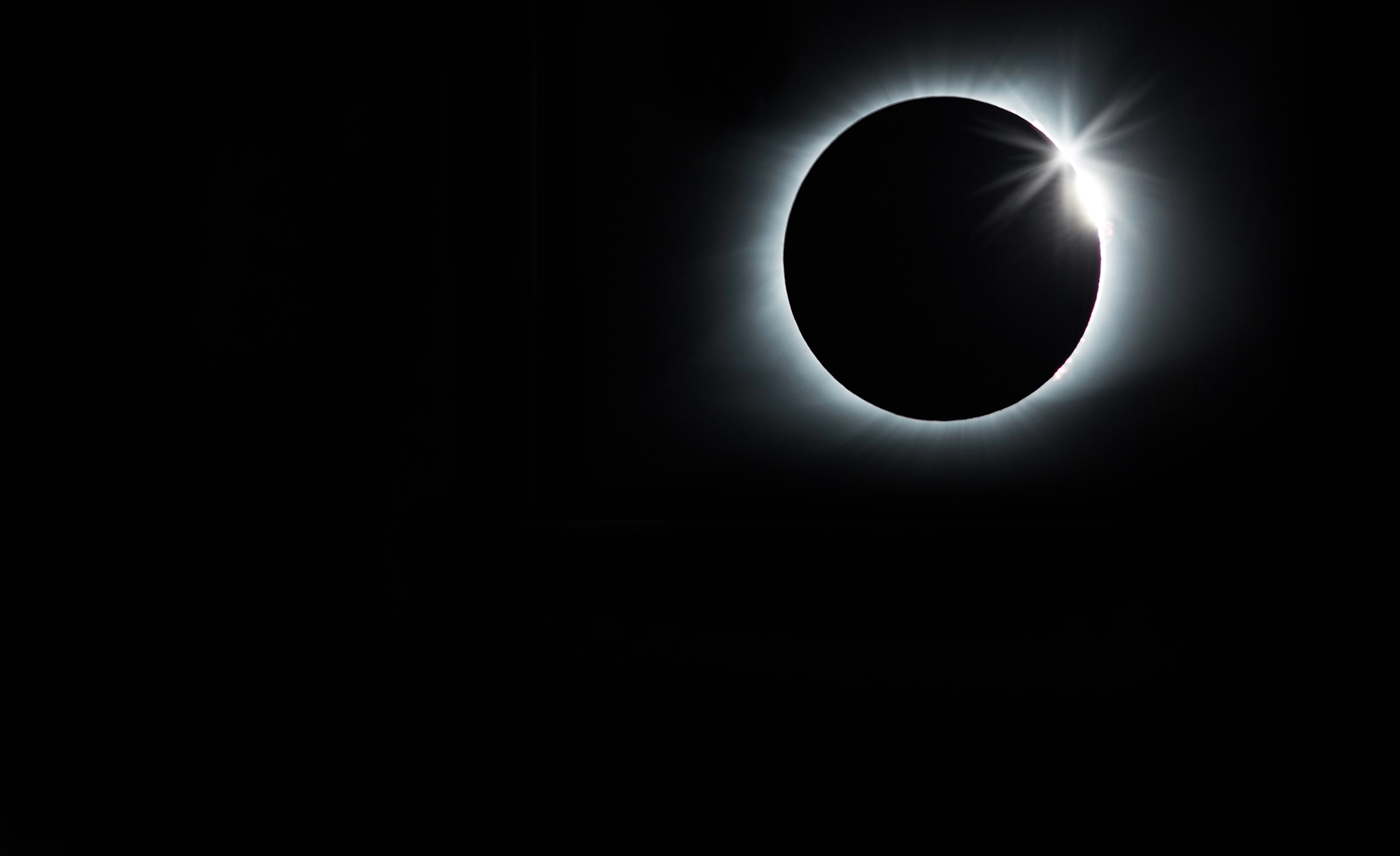 Total solar eclipse on black background 